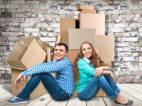 Professional movers handling furniture in a Belgravia townhouse